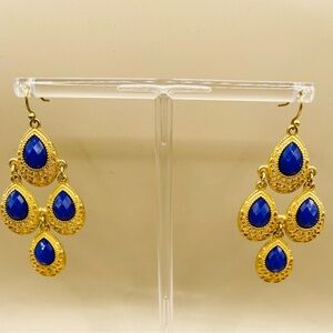 Blue faceted stone teardrop in gold tone metal earring. Dangle. Chandelier.